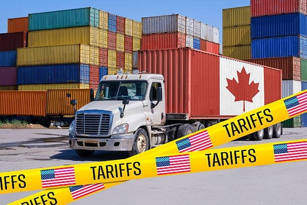 Canadian shipping truck at a container yard blocked by tariff warning tape, symbolizing US-Canada cross-border tariff restrictions