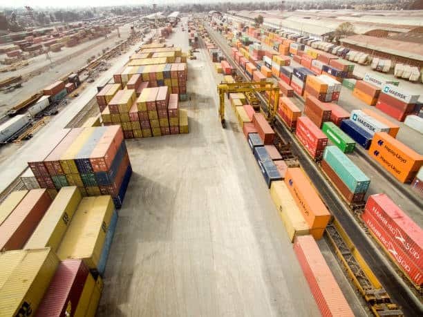 Import from Mexico showing large container yard with shipping boxes ready for transport.