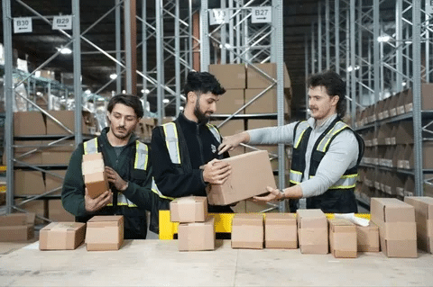 Warehouse staff processing and preparing DTC fulfillment orders for shipping.