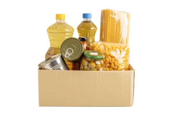 cardboard box containing packaged pasta oil and canned goods for shipment