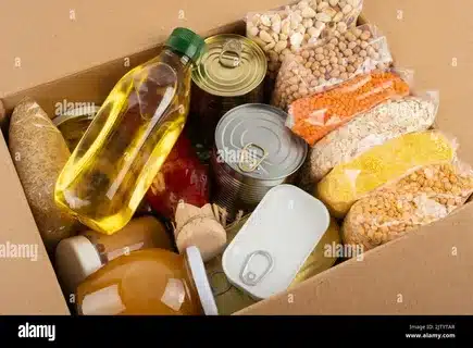 packaged food box with canned goods and supplies for shipping preparation