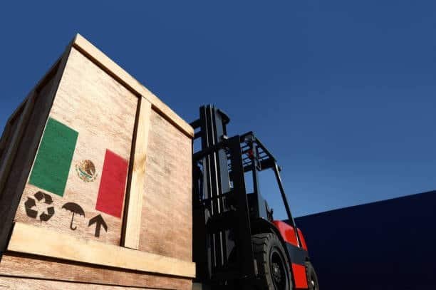 Import from Mexico wooden crate lifted by forklift for shipment.