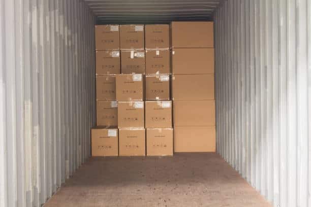 “View inside container showing cartons tightly stacked for full container load shipping”