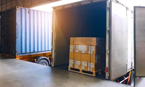 “Loading cargo pallet into truck at container freight station for LCL shipping and CFS charges calculation”