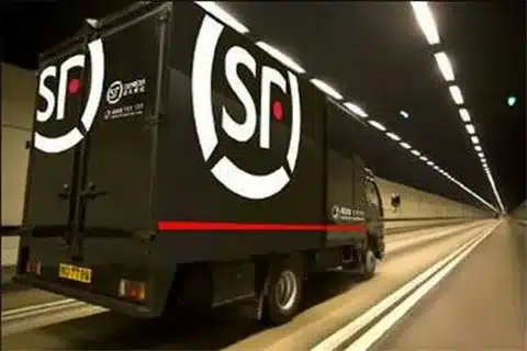 SF Express to USA truck on route transporting goods for delivery.