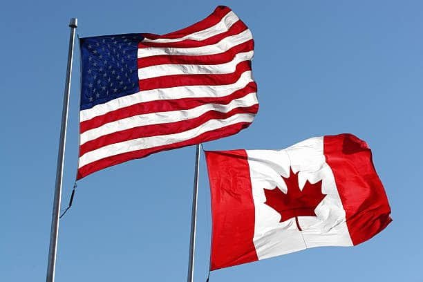 US and Canada flags representing cross-border shipping between Canada and the United States