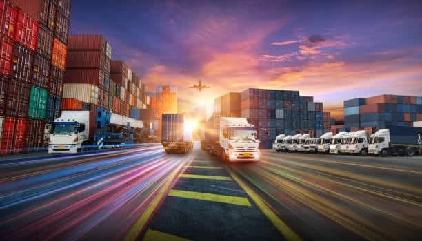 Logistics hub with trucks, cargo containers, and airplane representing global transport.