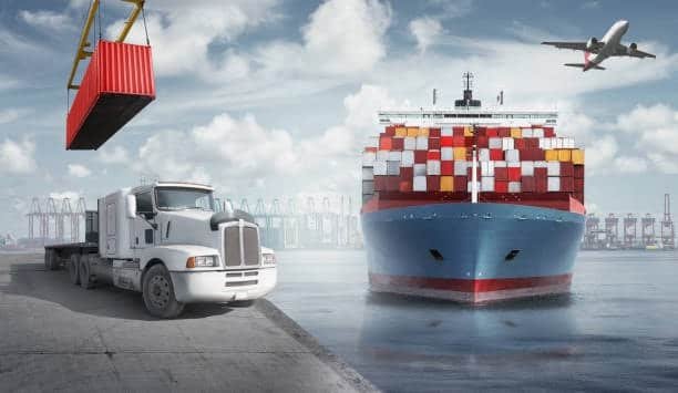 White drayage truck at port beside a container ship and airplane in sky, symbolizing multimodal logistics and drayage in global shipping.