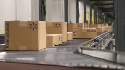 Walmart fulfillment center conveyor system with packages ready for distribution.