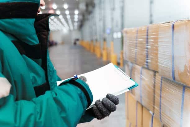 Discount on shipping warehouse manager supervising efficient supply chain.