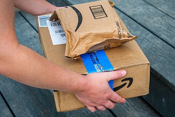 Close-up of Amazon branded shipping box showing approved corrugated packaging
