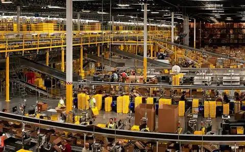 Fulfillment center staff processing, packing, and managing orders.