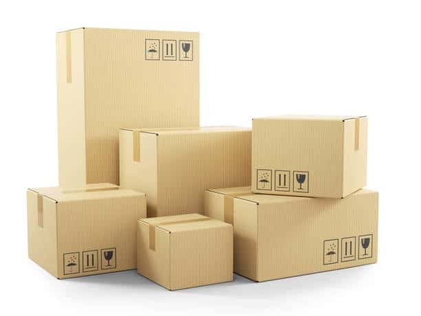 Stacked cardboard boxes in various sizes for packing and shipping large items.