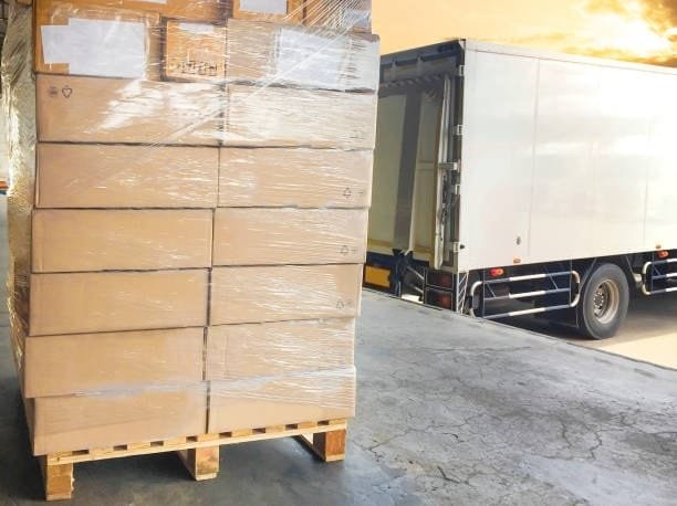 Freight pallets positioned at the loading dock after being cleared by customs authorities