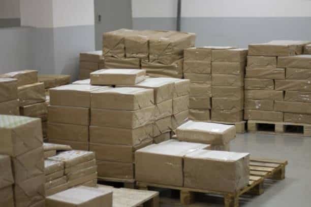 Wrapped parcels stacked on pallets after customs inspection and cargo release