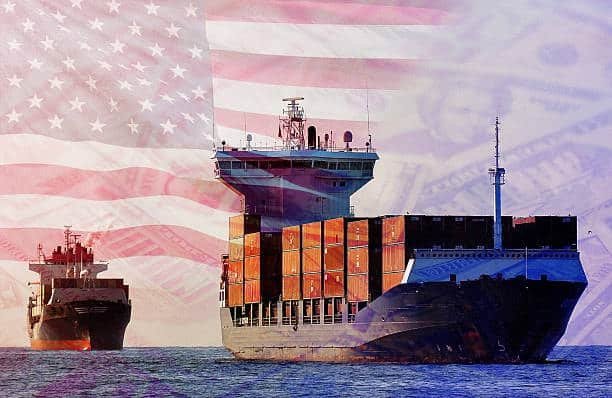 Two cargo ships with an American flag overlay representing US export freight and economy shipping outside the US.