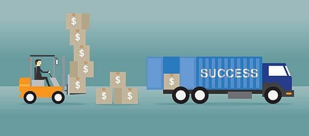 Forklift moving boxes toward a truck to illustrate FCA Incoterms where the seller delivers goods to the carrier at the named place.