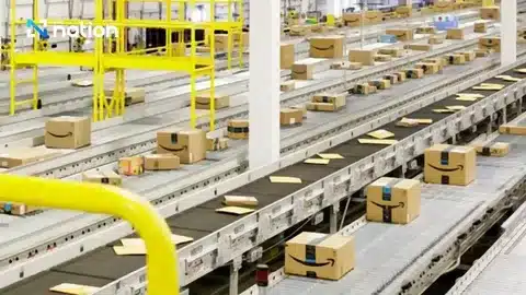 Conveyor belts transporting parcels through fulfillment center operations.