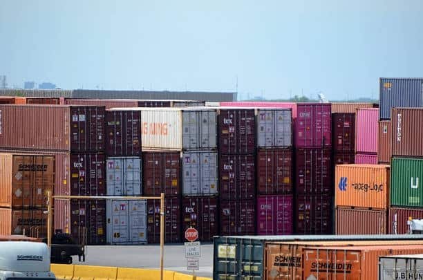 Stacked shipping containers prepared for economy shipping outside the United States.