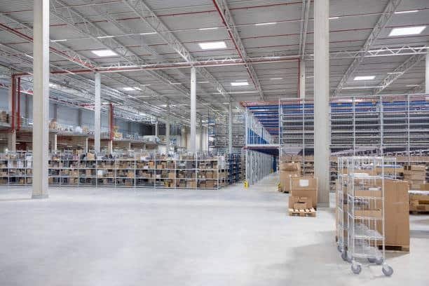 Spacious distribution center storing boxed freight ready for shipping large items.