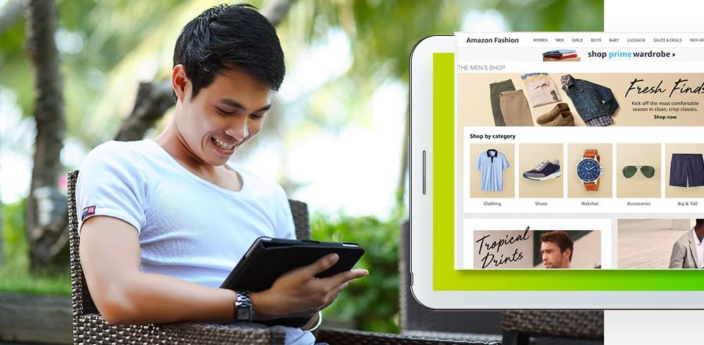 Customer browsing Amazon Fashion on a tablet to shop apparel and accessories online.