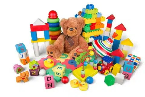 Assorted collection of imported toys including plush, wooden, and educational items