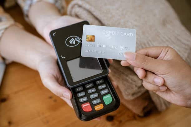Secure contactless credit card transaction showing payment safety.