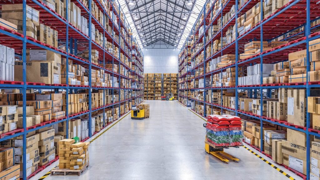 Wide-angle view of a large apparel fulfillment center with high racks and extensive inventory storage.