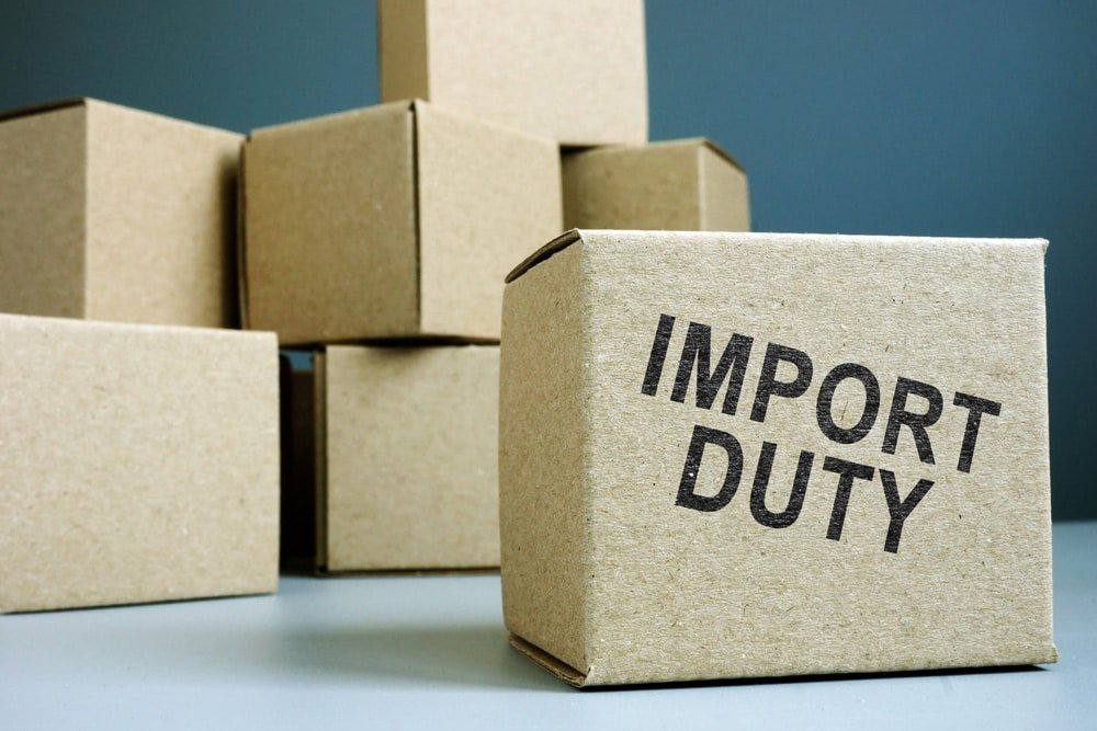 Cardboard box labeled “Import Duty” symbolizing import taxes and customs tariffs on goods shipped from China, used in a 2025 duty optimization guide.