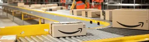 Amazon FBA shipping conveyor system moving packed apparel orders to outbound delivery