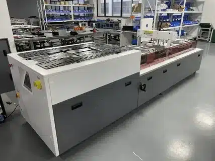 Automated apparel bagging packaging line supporting high volume clothing shipping preparation