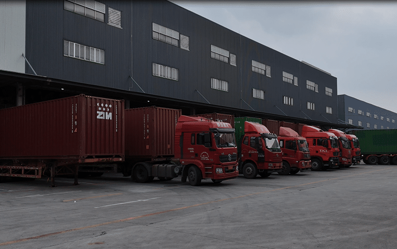 Container trucks lined up for loading at BM Supply Chain’s logistics hub in China, preparing shipments for global delivery as part of the fulfillment process.