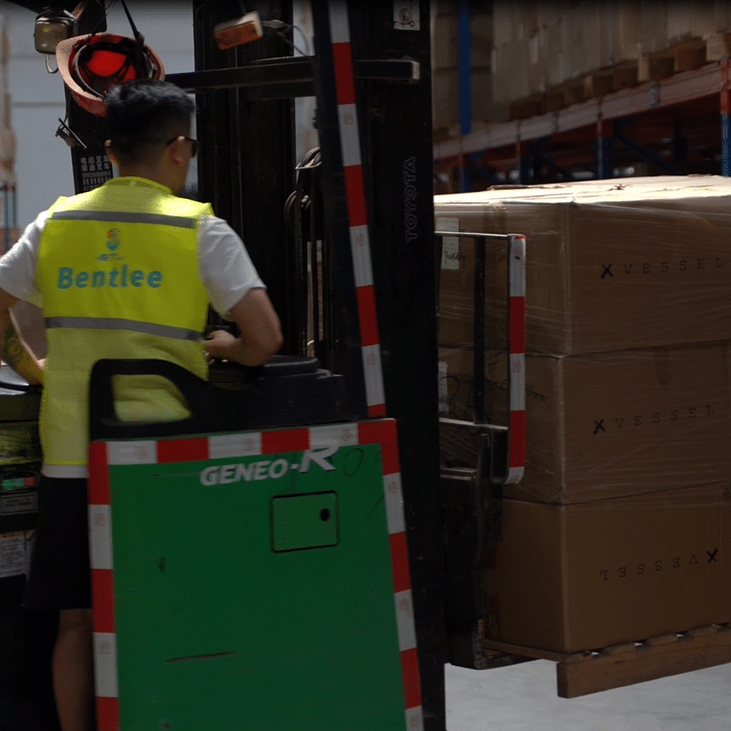 Warehouse staff picking and packing boxes for global B2B shipping from China.
