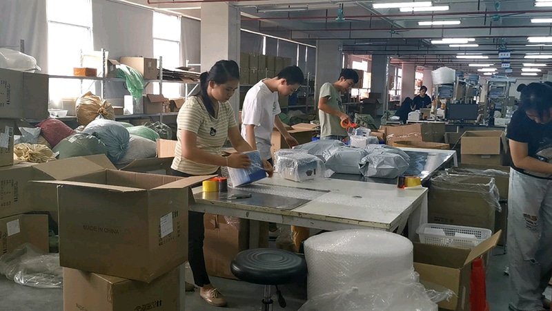 Warehouse staff conducting pick-and-pack operations, ensuring order accuracy and quality control for B2B shipments.