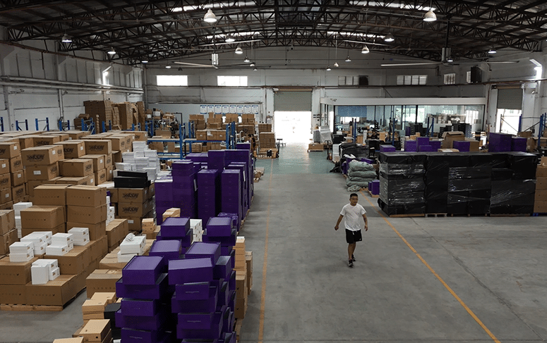 Warehouse inventory receiving process at BM Supply Chain, showing incoming products being prepared for inspection and storage during Step 1 of the fulfillment workflow.