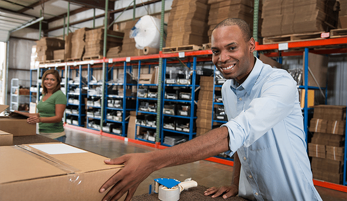 Warehouse staff packing and sealing cartons as part of the B2B fulfillment and shipping preparation workflow in a China fulfillment center