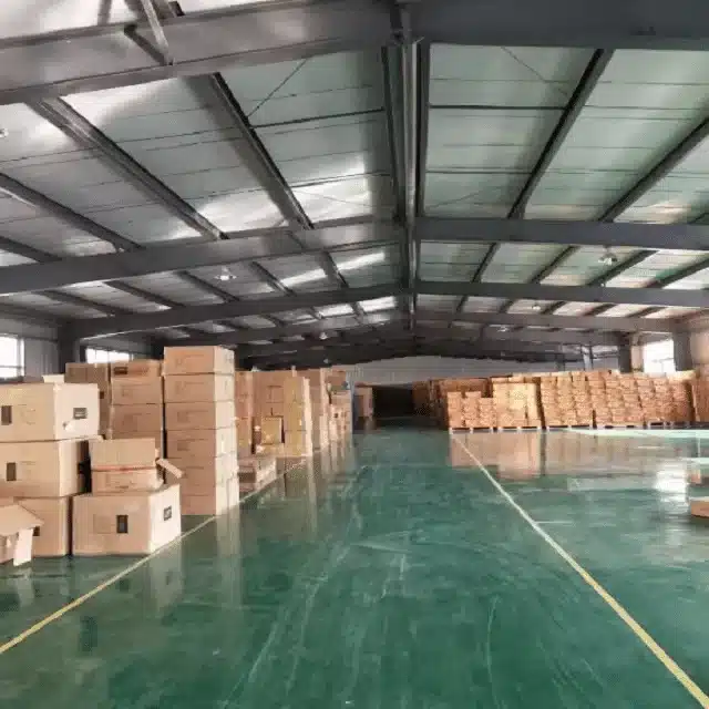 Warehouse in China with stacked cartons ready for Amazon FBA pre-shipment inspection.