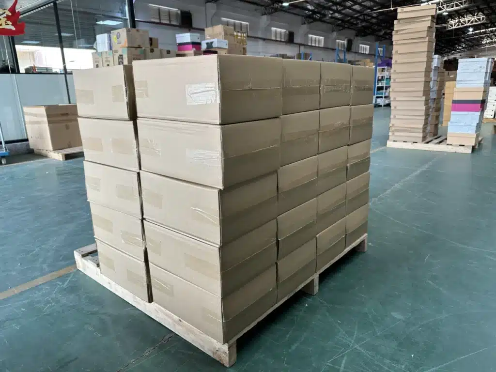 Sealed cardboard cartons stacked on a wooden pallet in a China fulfillment warehouse, illustrating storage space and pallet handling.
