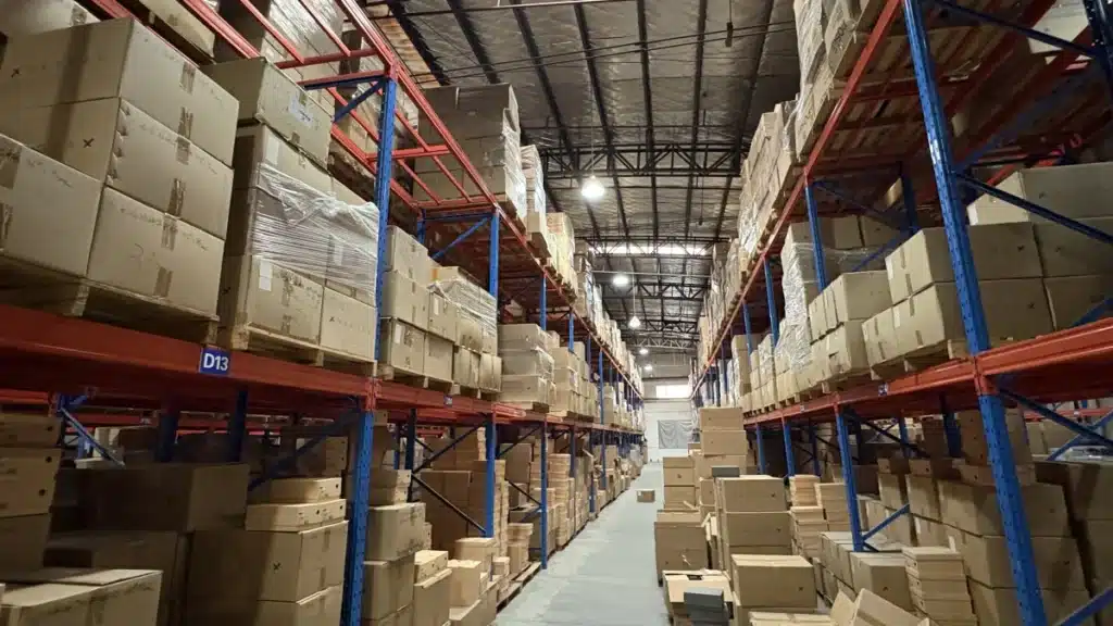 Fulfillment warehouse with organized storage racks and palletized inventory during a 3PL warehouse visit and operational performance audit.