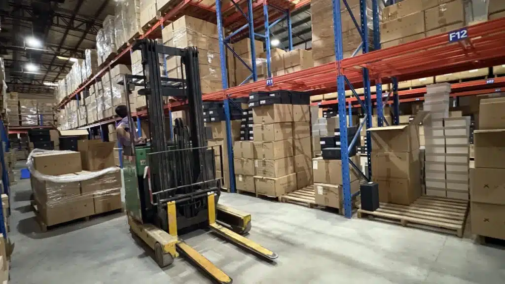 Forklift operating inside a 3PL fulfillment warehouse with palletized inventory, supporting efficient logistics and lower shipping costs relative to average order value.