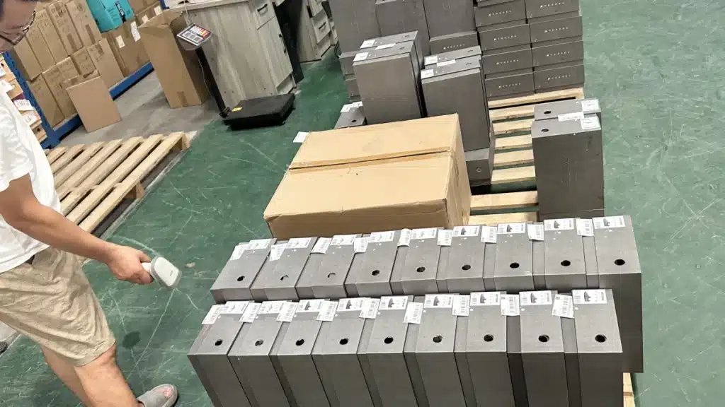 Warehouse worker scanning labeled ecommerce products with a barcode scanner to improve order accuracy rate, inventory tracking, and fulfillment performance.