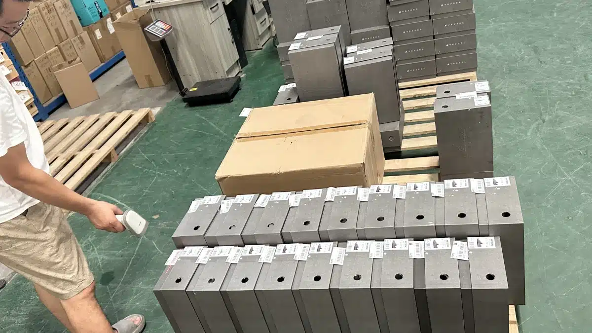 Warehouse worker scanning labeled ecommerce products with a barcode scanner to improve order accuracy rate, inventory tracking, and fulfillment performance.