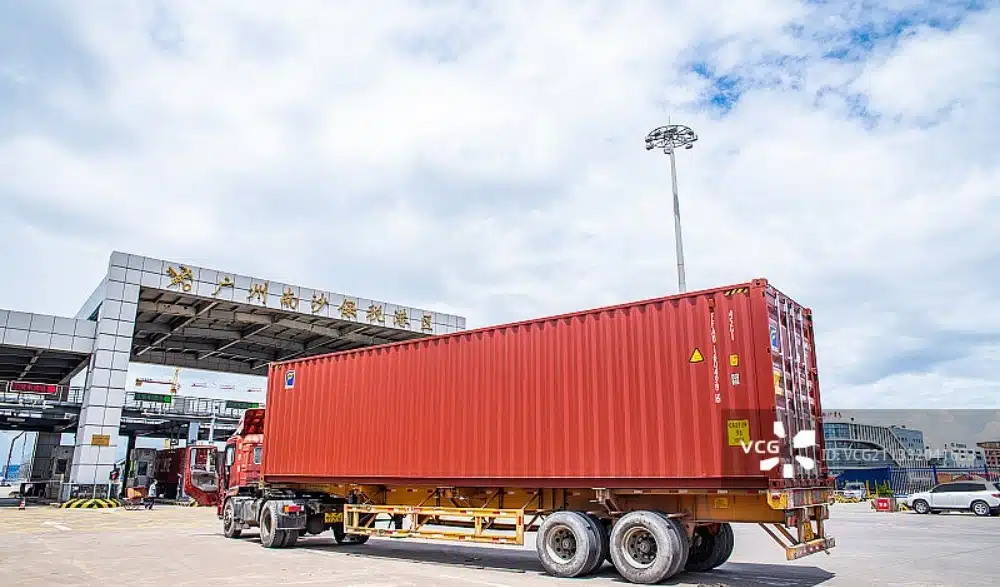 Container truck entering a Chinese port as part of a shipment rerouting strategy during port congestion