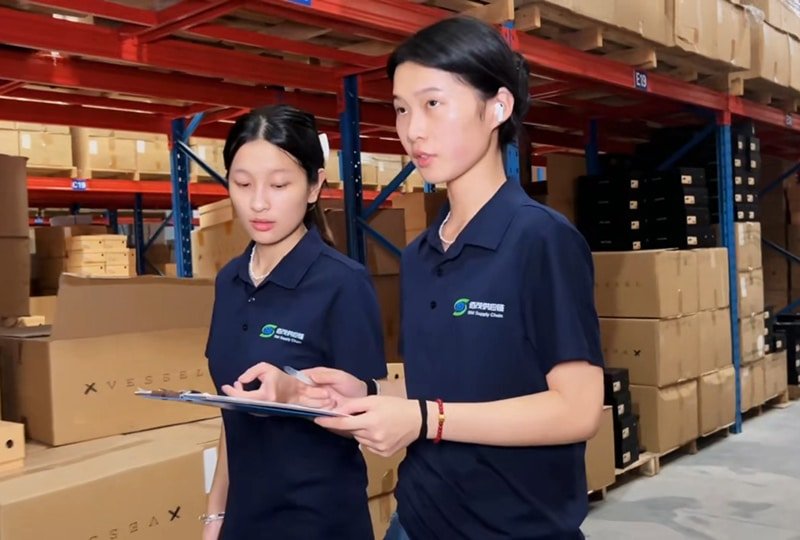 warehouse staff in dongguan managing inventory and checking stock in fulfillment warehouse