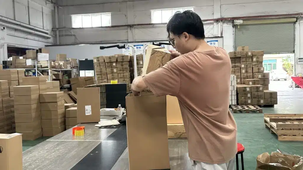 Warehouse worker packing ecommerce products for accurate order fulfillment, helping improve delivery experience, customer retention, and repeat purchase rates.