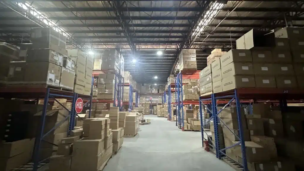 Ecommerce warehouse with organized inventory storage supporting reliable fulfillment, shipping performance, and customer retention analysis.