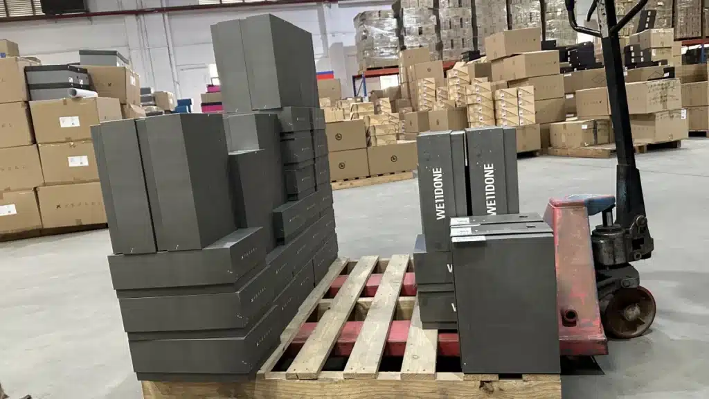 Ecommerce orders consolidated on a warehouse pallet before shipment, showing how order size, product weight, and shipping data influence carrier and shipping method selection.