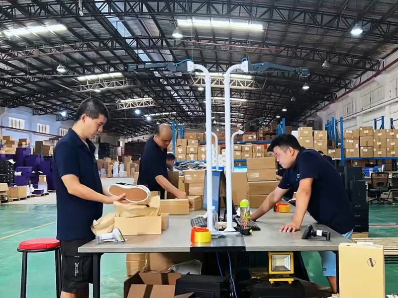 warehouse workers performing pick and pack fulfillment process for ecommerce orders