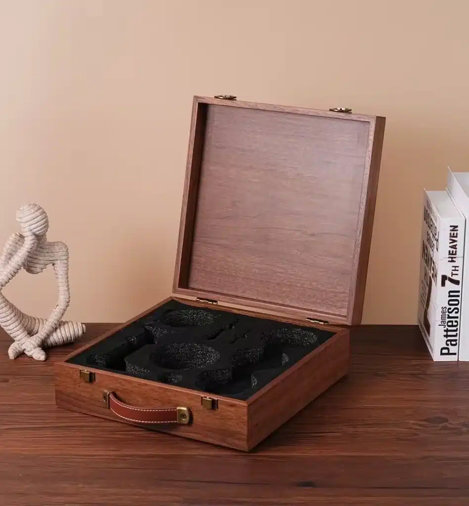 Open wooden gift box with protective foam inserts designed for a premium branded unboxing experience