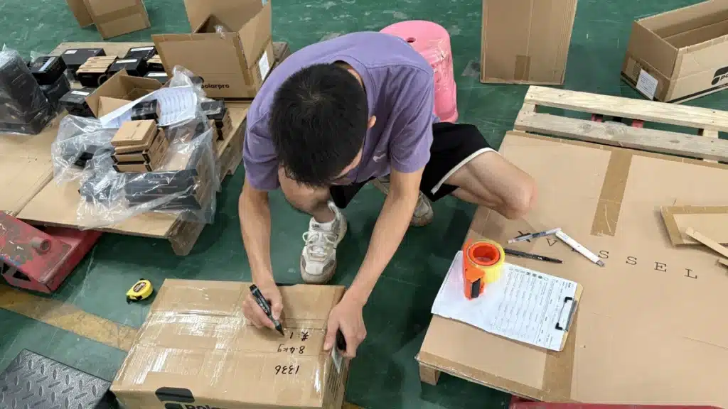 Warehouse worker measuring and recording package details to support accurate shipping cost calculations for eCommerce checkout and fulfillment optimization.